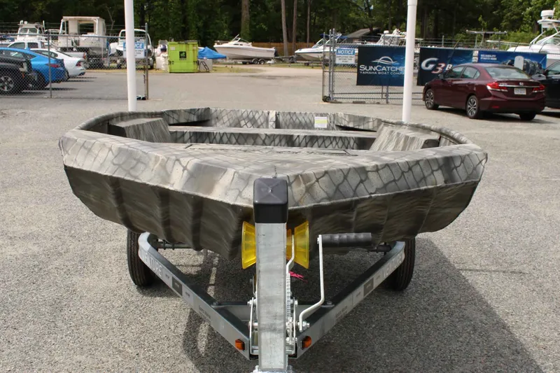 Slide: The Image of 2026 WeldBilt 1552V boat on a trailer outdoors. - 8