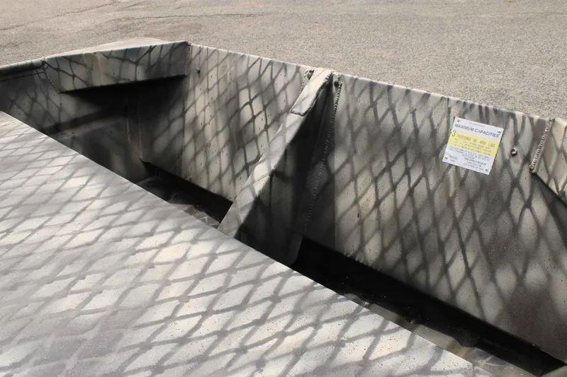 Slide: The Image of WeldBilt 1552V 2026 boat with camouflage pattern and capacity sign. - 9