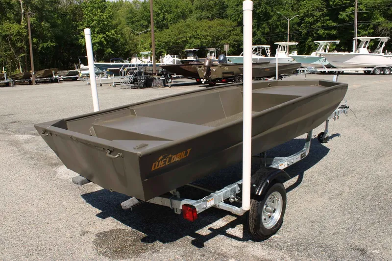 Slide: The Image of 2026 WeldBilt 1448V aluminum boat on trailer outdoors. - 3