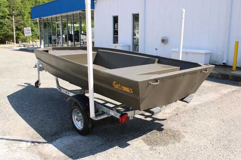 Slide: The Image of 2026 WeldBilt 1448V boat on trailer outside a building. - 5