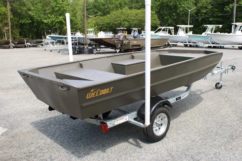 Slide: The Image of 2026 WeldBilt 1448V boat on trailer outdoors. - 8