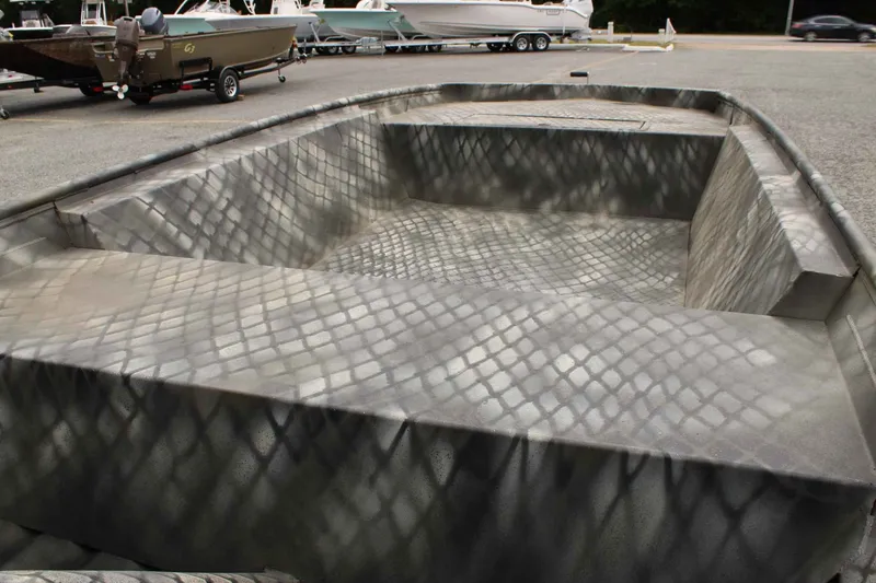 Slide: The Image of 2026 WeldBilt 1448V boat with camouflage pattern on parking lot. - 10