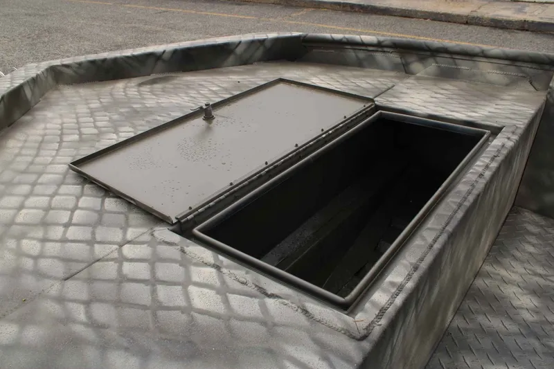 Slide: The Image of WeldBilt 1448V 2026 boat with open storage compartment on deck. - 11