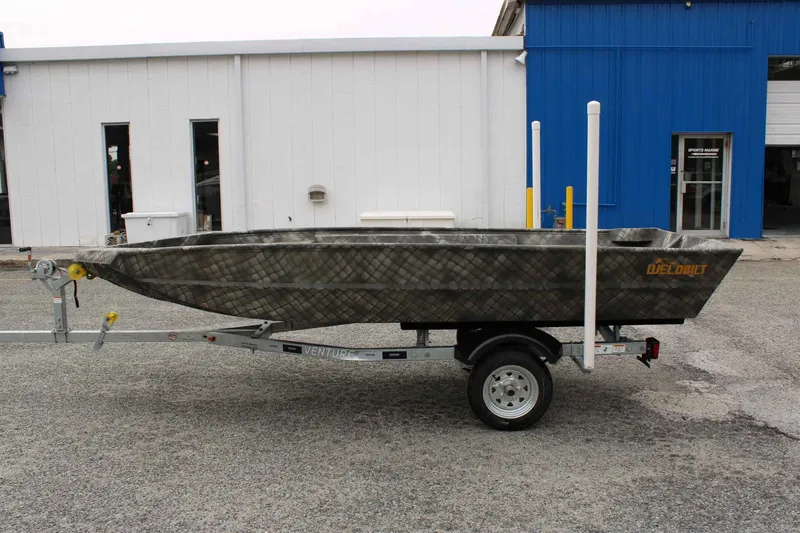 Slide: The Image of WeldBilt 1448V boat on trailer in front of blue building, year 2026. - 3