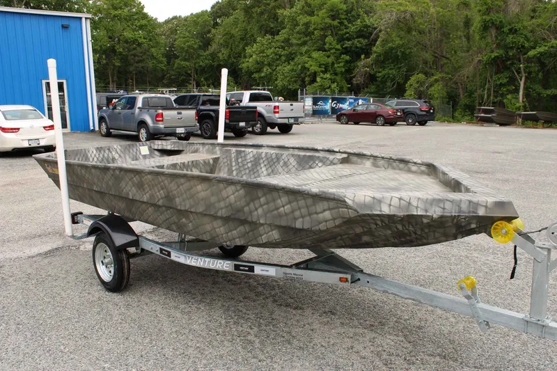 Slide: The Image of WeldBilt 1448V 2026 aluminum boat on trailer parked outdoors. - 8