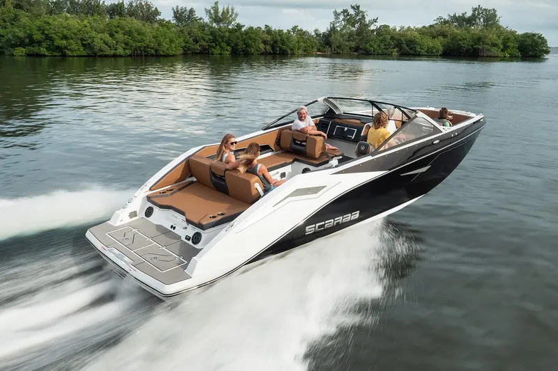Slide: The Image of 2021 Scarab 285 ID boat cruising on a calm river. - 6