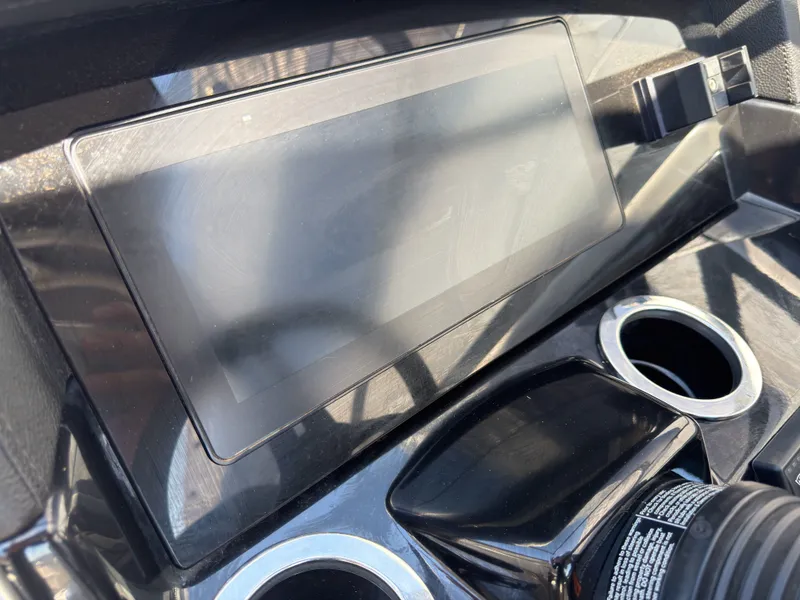 Slide: The Image of Yamaha Boats 2020 242S dashboard with screen and cup holders. - 11