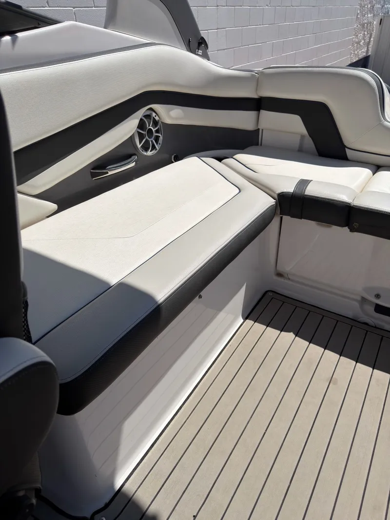 Slide: The Image of Interior of a 2020 Yamaha Boats 242S with gray upholstery. - 13