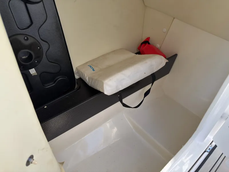 Slide: The Image of Interior of a 2020 Yamaha Boats 242S with seating and storage. - 14