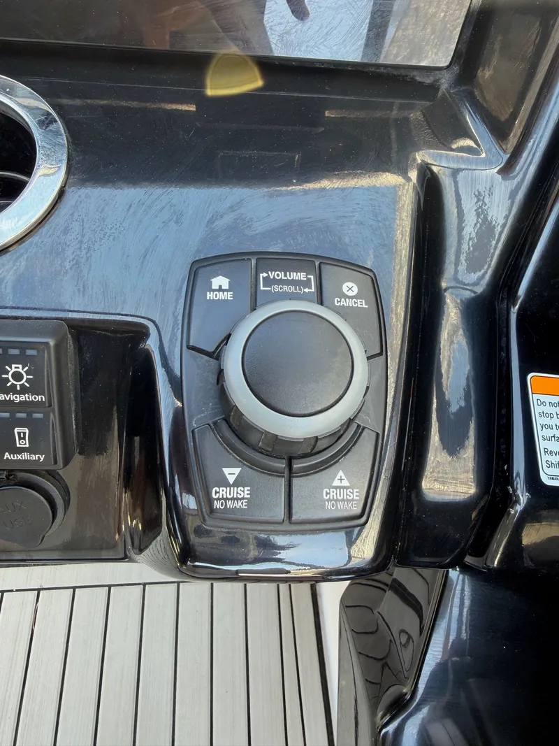 Slide: The Image of Control panel of 2020 Yamaha Boats 242S with navigation buttons. - 15