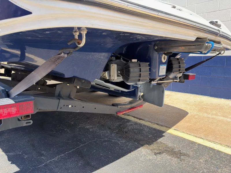 Slide: The Image of Rear view of a 2020 Yamaha 242S boat on a trailer. - 16