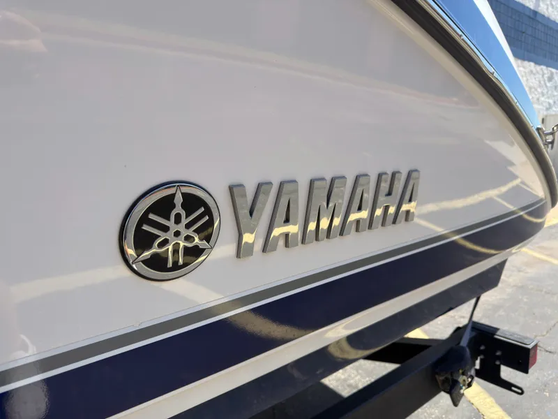 Slide: The Image of Yamaha Boats 242S 2020 with logo on the side. - 32