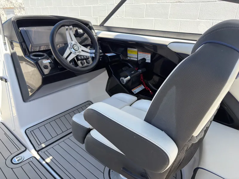 Slide: The Image of Interior view of a 2020 Yamaha Boats 242S helm station. - 6