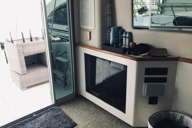 Slide: The Image of Interior of 1995 Sea Ray 550 Sedan Bridge yacht with modern amenities and decor. - 14