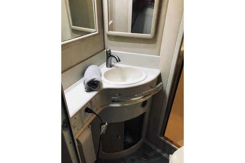 Slide: The Image of Bathroom sink area in 1995 Sea Ray 550 Sedan Bridge yacht. - 30