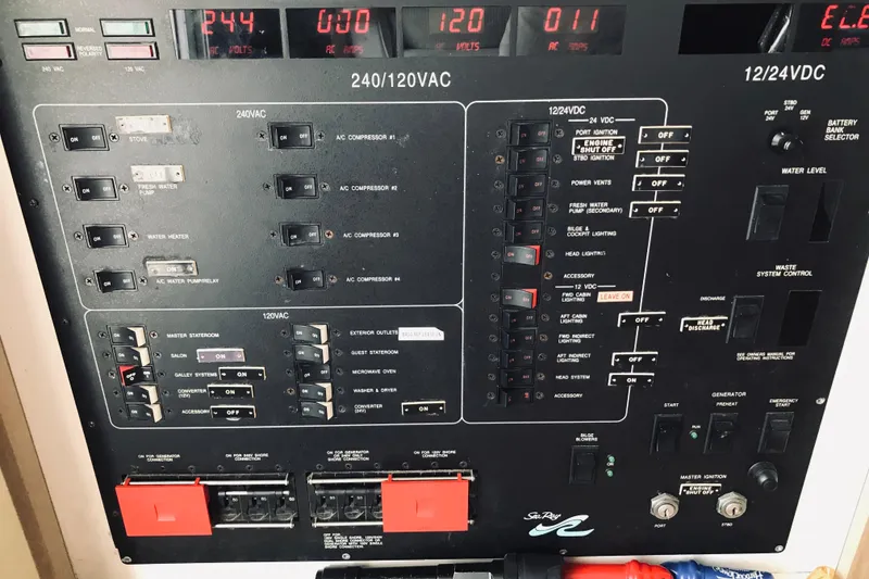 Slide: The Image of Control panel of a 1995 Sea Ray 550 Sedan Bridge yacht, displaying various electrical switches. - 32