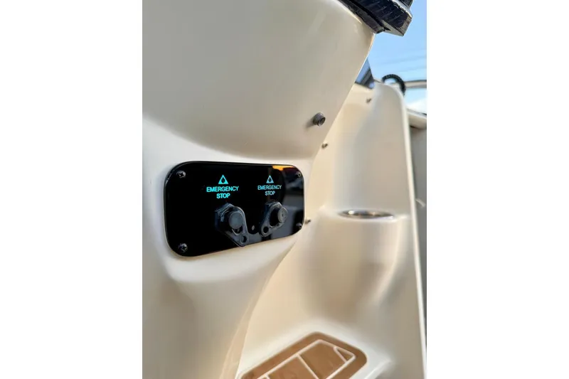 Slide: The Image of 2006 Hydra-Sports Vector 3300 VX emergency stop controls on boat dashboard. - 10