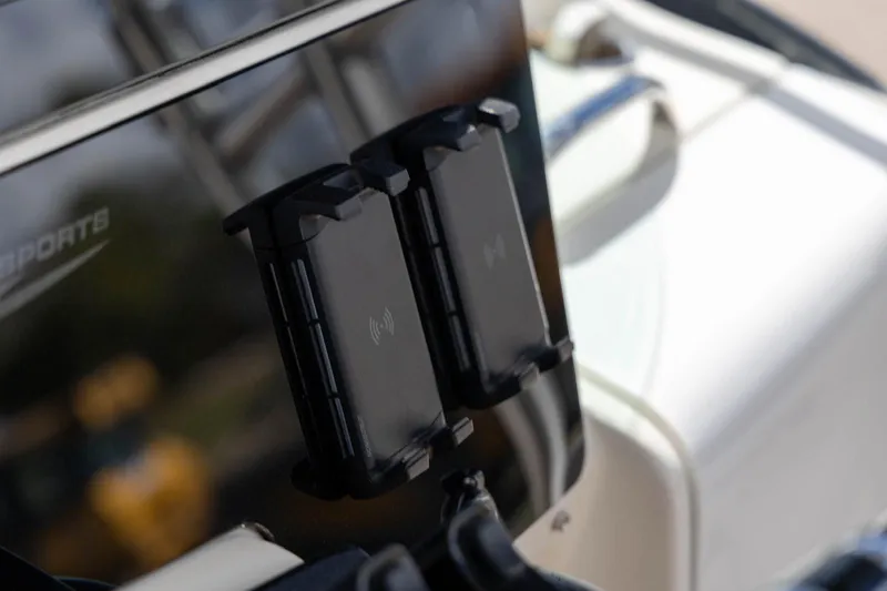 Slide: The Image of Close-up of a 2006 Hydra-Sports Vector 3300 VX boat dashboard with mounted devices. - 11