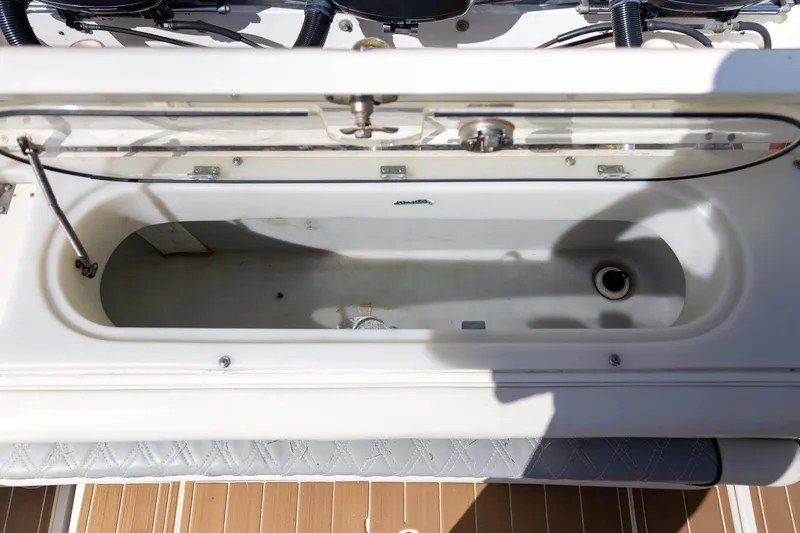 Slide: The Image of Open storage compartment on a 2006 Hydra-Sports Vector 3300 VX boat. - 22