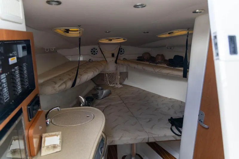 Slide: The Image of 2006 Hydra-Sports Vector 3300 VX cabin interior with seating and amenities. - 23