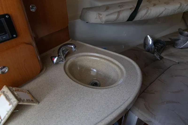 Slide: The Image of 2006 Hydra-Sports Vector 3300 VX cabin sink with faucet and cushioned seating. - 28