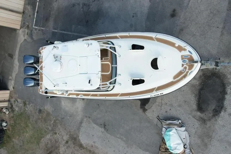 Slide: The Image of Aerial view of a 2006 Hydra-Sports Vector 3300 VX boat on asphalt. - 3