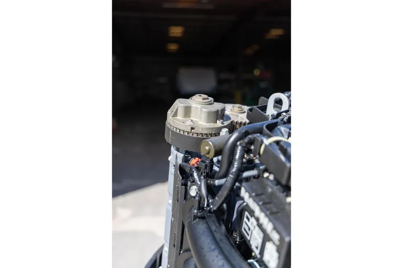 Slide: The Image of Close-up of a 2006 Hydra-Sports Vector 3300 VX engine component in a workshop setting. - 30