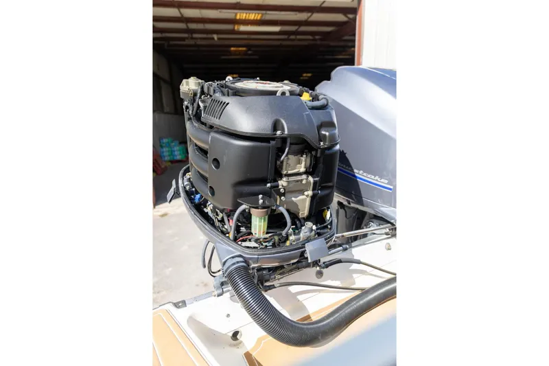 Slide: The Image of 2006 Hydra-Sports Vector 3300 VX boat engine, detailed view in a garage setting. - 33
