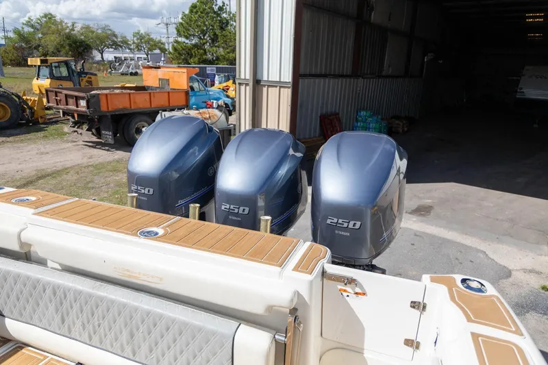 Slide: The Image of 2006 Hydra-Sports Vector 3300 VX with triple Yamaha 250 engines in a boatyard. - 4