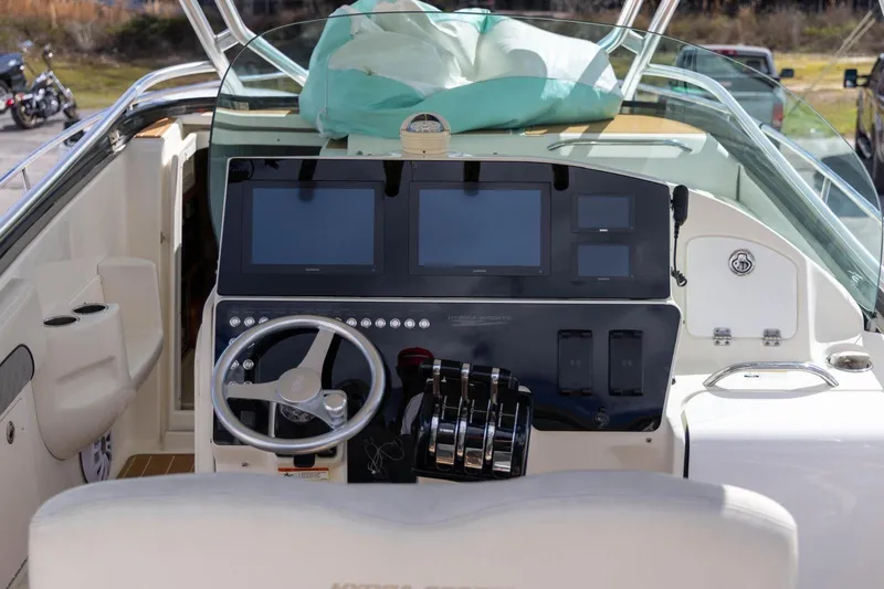 Slide: The Image of 2006 Hydra-Sports Vector 3300 VX boat cockpit with steering wheel and control panel. - 7