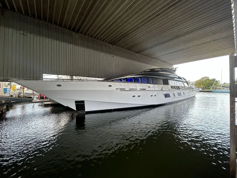 Slide: The Image of Heesen 141 Motor Yacht 1992 docked under a covered marina. - 4