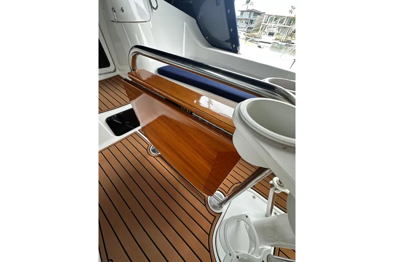 Slide: The Image of Hunter 426 Deck Salon 2003 interior with polished wood and sleek design elements. - 12