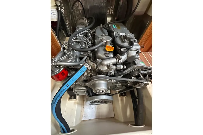 Slide: The Image of Engine of a 2003 Hunter 426 Deck Salon sailboat, showcasing mechanical components. - 36