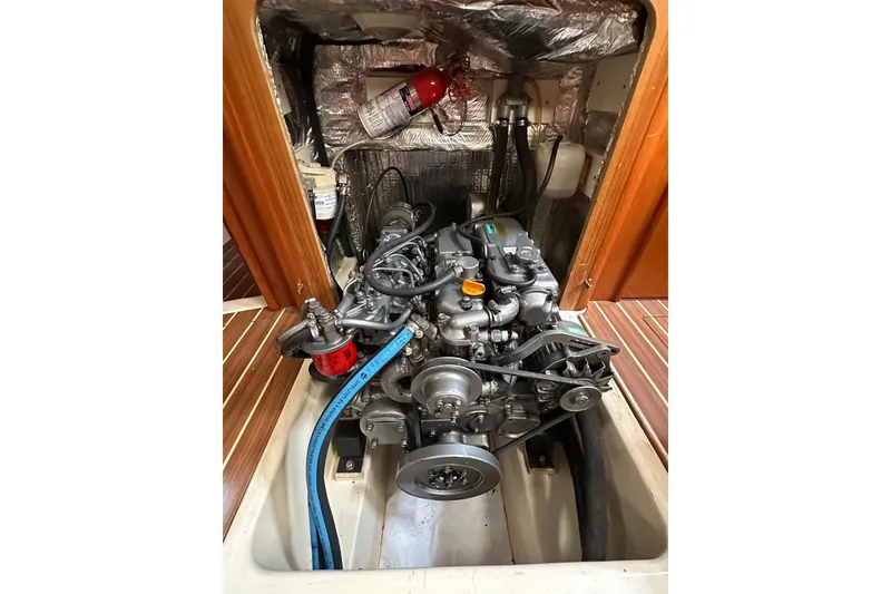 Slide: The Image of Engine compartment of 2003 Hunter 426 Deck Salon sailboat, showcasing mechanical components. - 37