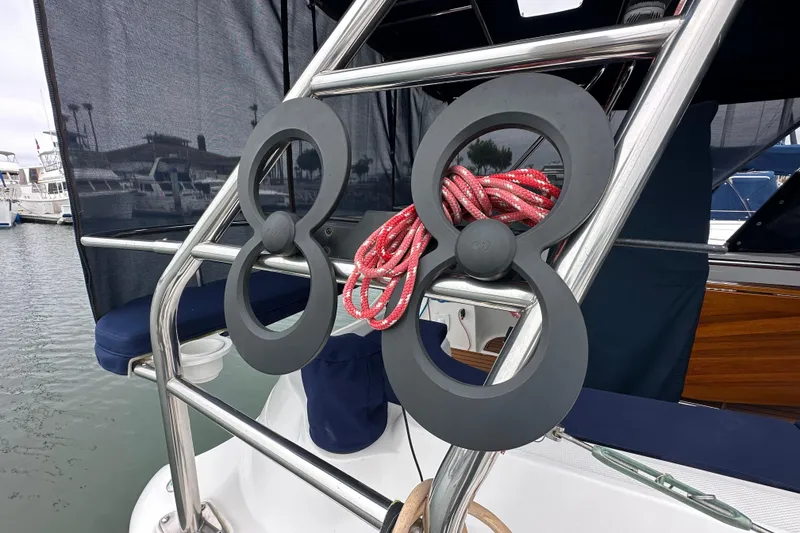 Slide: The Image of Close-up of a 2003 Hunter 426 Deck Salon sailboat with red rope and metal frame. - 6