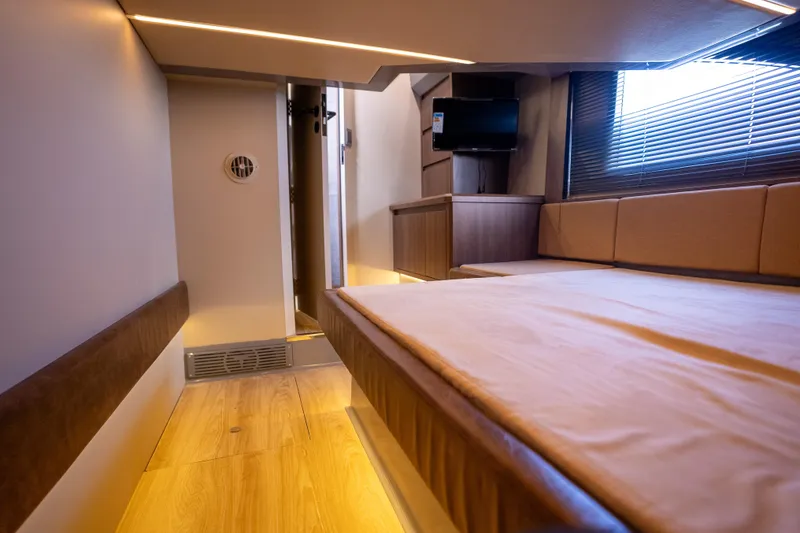 Slide: The Image of Luxurious interior of 2027 Hanover 447 yacht with modern furnishings and ambient lighting. - 4