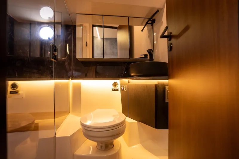 Slide: The Image of Luxurious bathroom in 2027 Hanover 447 model, featuring modern fixtures and ambient lighting. - 6