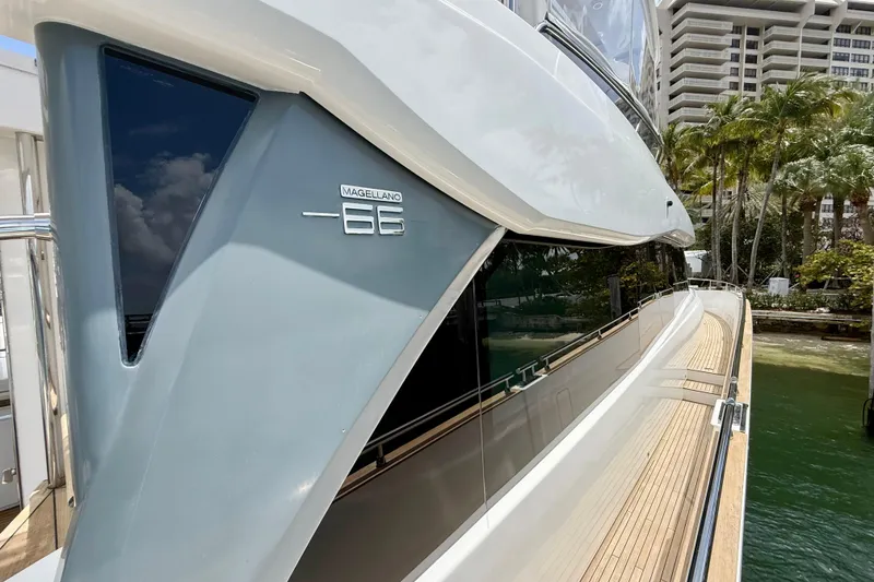Slide: The Image of 2020 Azimut Magellano 66 yacht docked, showcasing sleek design and luxurious deck. - 10
