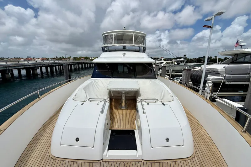 Slide: The Image of Azimut Magellano 66 yacht, 2020 model, docked with spacious deck and seating area. - 13