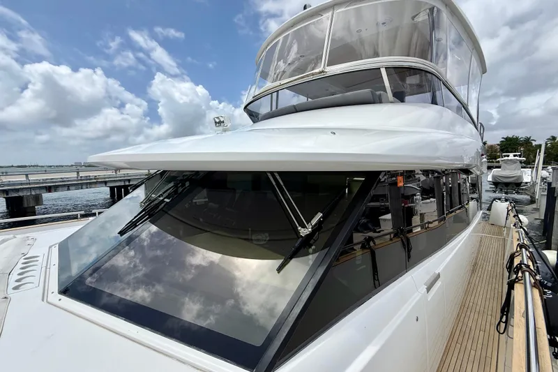 Slide: The Image of 2020 Azimut Magellano 66 yacht docked, showcasing sleek design and modern features. - 15