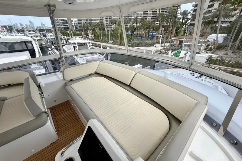 Slide: The Image of Luxurious seating area on 2020 Azimut Magellano 66 yacht, docked at a marina. - 22