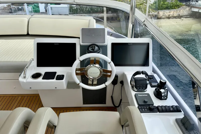 Slide: The Image of Cockpit of 2020 Azimut Magellano 66 yacht with modern navigation equipment and controls. - 24