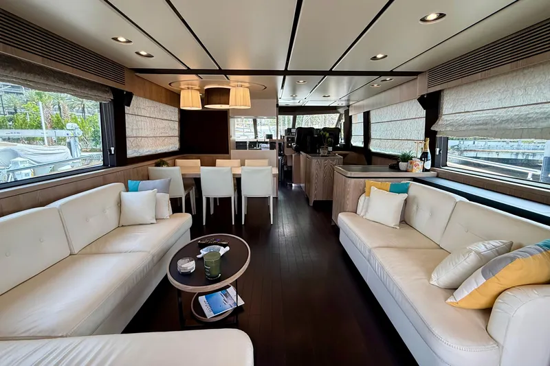 Slide: The Image of Luxurious interior of 2020 Azimut Magellano 66 yacht with elegant seating and dining area. - 26