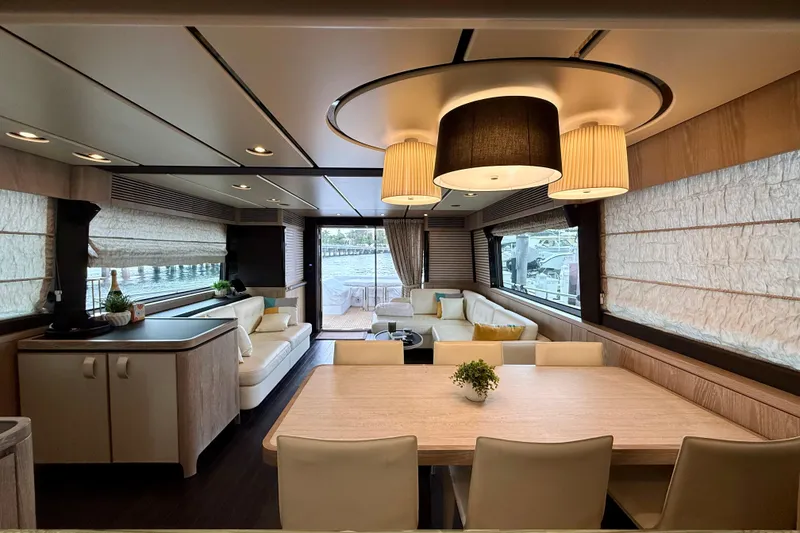 Slide: The Image of Luxurious interior of 2020 Azimut Magellano 66 yacht with elegant dining and seating area. - 30