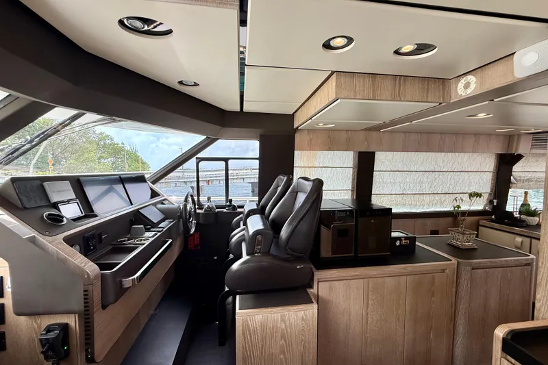 Slide: The Image of Luxurious interior of 2020 Azimut Magellano 66 yacht with modern helm and seating. - 36