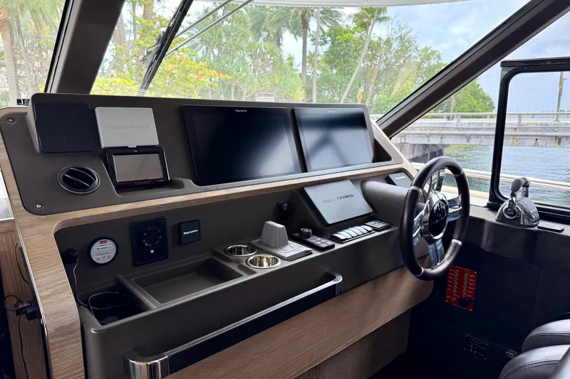 Slide: The Image of Helm of 2020 Azimut Magellano 66 yacht with modern navigation equipment and controls. - 38