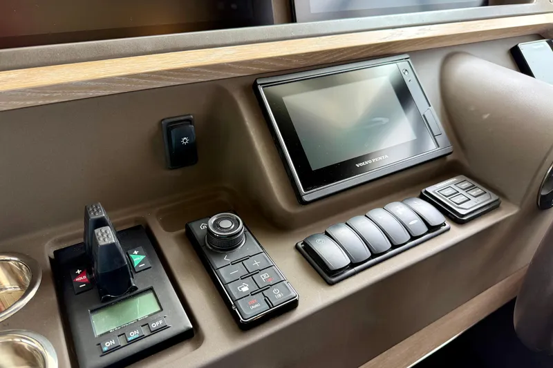 Slide: The Image of Control panel of a 2020 Azimut Magellano 66 yacht with navigation and control switches. - 42