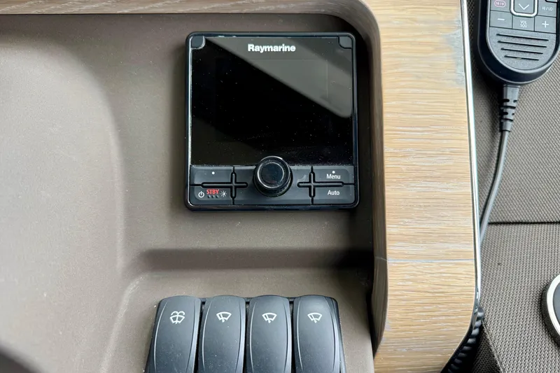 Slide: The Image of Control panel of a 2020 Azimut Magellano 66 yacht featuring Raymarine equipment. - 45