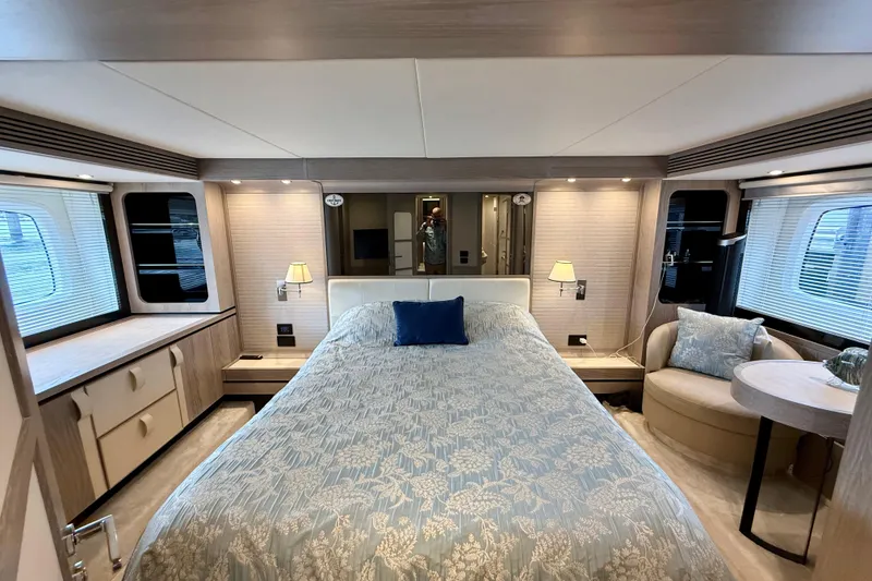 Slide: The Image of Luxurious bedroom interior of 2020 Azimut Magellano 66 yacht with elegant decor and furnishings. - 49