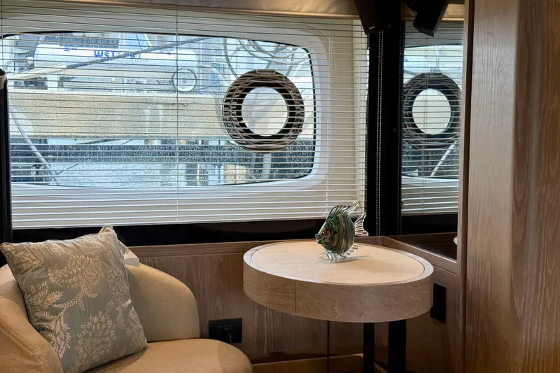 Slide: The Image of Luxurious interior of 2020 Azimut Magellano 66 yacht with elegant decor and window view. - 51